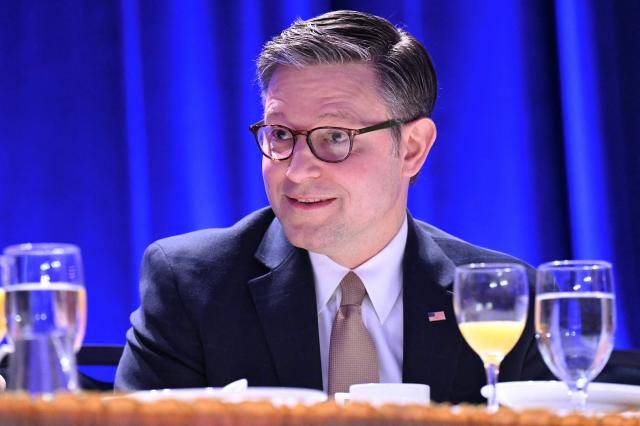 Speaker of the House Mike Johnson, Repulican from Louisiana, looks on before US President Trump speaks during the National Prayer Breakfast at the Washington Hilton in Washington, DC on February 5, 2026. (Photo by SAUL LOEB / AFP)