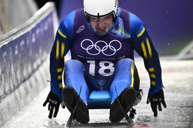 Ukraine's Andriy Mandziy takes part in the luge men's singles training session at Cortina Sliding Centre during the Milano Cortina 2026 Winter Olympic Games in Cortina d'Ampezzo on February 5, 2026. (Photo by Marco BERTORELLO / AFP)