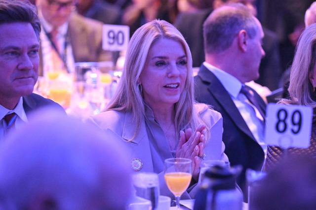 US Attorney General Pam Bondi looks on before US President Trump speaks during the National Prayer Breakfast at the Washington Hilton in Washington, DC on February 5, 2026. (Photo by SAUL LOEB / AFP)