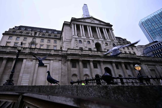 Pigeons are pictured outside the Bank of England in central London on February 5, 2026. The Bank of England on February 5 cut its forecasts for UK growth this year and next, as it left its benchmark interest rate at 3.75 percent. (Photo by Ben STANSALL / AFP)