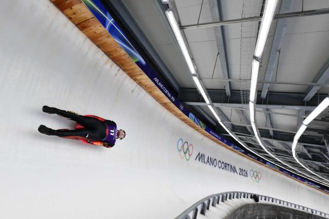 China's Bao Zhenyu takes part in the luge men's singles training session at Cortina Sliding Centre during the Milano Cortina 2026 Winter Olympic Games in Cortina d'Ampezzo on February 5, 2026. (Photo by Stefano RELLANDINI / AFP)