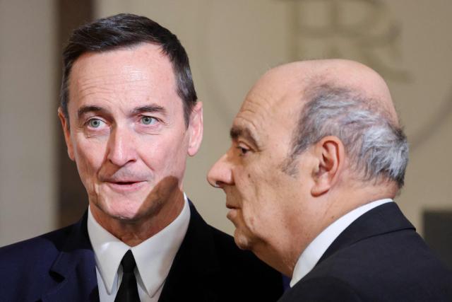 General Chief of Staff of the French armed Forces Fabien Mandon (L) waits with chairman of Groupe Industriel Marcel Dassault and CEO of Dassault Aviation Eric Trappier (R) ahead of a public video conference with French astronaut Sophie Adenot ahead of her departure for the International Space Station, at the presidential Elysee Palace in Paris on February 5, 2026. Four astronauts could blast off to the International Space Station (ISS) next week, after setbacks including a mysterious medical evacuation of the previous crew, last-minute rocket problems, and some scheduling conflicts with NASA's Moon mission. (Photo by Ludovic MARIN / POOL / AFP)
