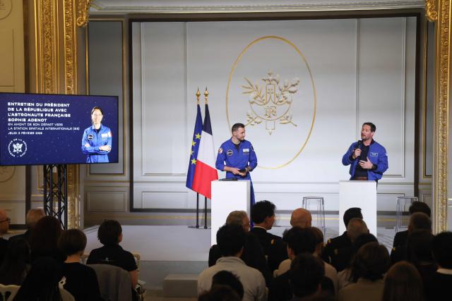 ESA (European Space Agency) French astronaut Thomas Pesquet (R) talks to French astronaut Arnaud Prost ahead of a public video conference with French astronaut Sophie Adenot ahead of her departure for the International Space Station, at the presidential Elysee Palace in Paris on February 5, 2026. Four astronauts could blast off to the International Space Station (ISS) next week, after setbacks including a mysterious medical evacuation of the previous crew, last-minute rocket problems, and some scheduling conflicts with NASA's Moon mission. (Photo by Ludovic MARIN / POOL / AFP)