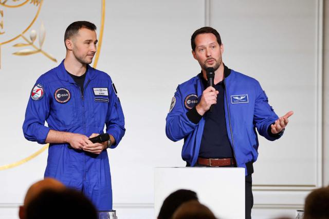ESA (European Space Agency) French astronaut Thomas Pesquet (R) talks to French astronaut Arnaud Prost ahead of a public video conference with French astronaut Sophie Adenot ahead of her departure for the International Space Station, at the presidential Elysee Palace in Paris on February 5, 2026. Four astronauts could blast off to the International Space Station (ISS) next week, after setbacks including a mysterious medical evacuation of the previous crew, last-minute rocket problems, and some scheduling conflicts with NASA's Moon mission. (Photo by Ludovic MARIN / POOL / AFP)
