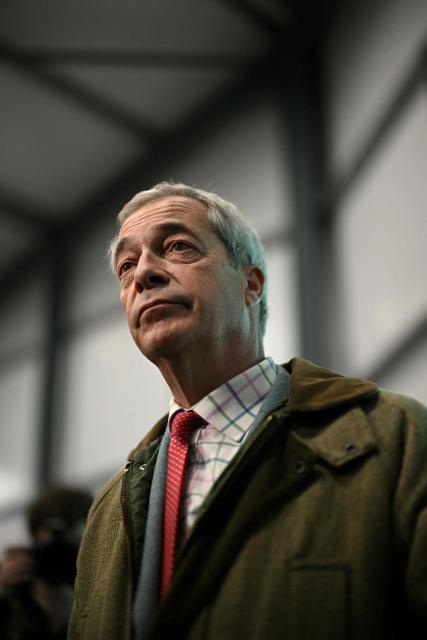 Reform UK leader Nigel Farage speaks to members of the media at the Gorton and Denton Reform UK campaign office, northwest England on February 5, 2026, ahead of the February 26 Gorton and Denton by-election. (Photo by Oli SCARFF / AFP)
