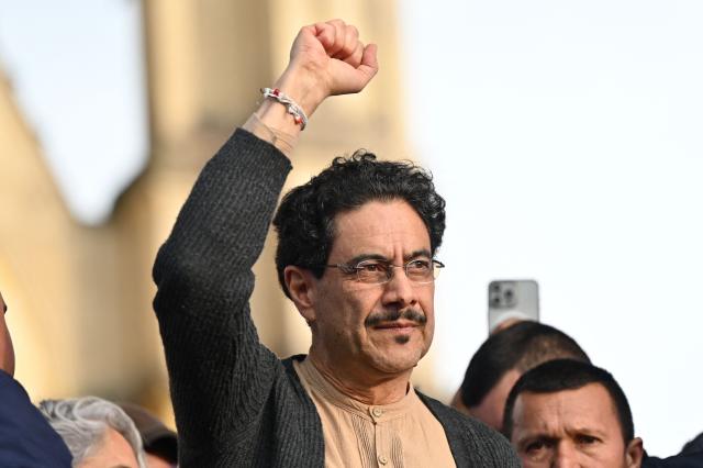 (FILES) Colombia's presidential candidate for the Pacto Historico party, Ivan Cepeda, raises his fist during a campaign rally at Lourdes Square in Bogota on February 3, 2026. The leading candidate for Colombia’s 2026 presidential election, left-wing Senator Ivan Cepeda, denounced on February 5, 2026 a “violation” by the electoral authority of his right to participate in the March primaries, a decision that has divided the ruling coalition. (Photo by Alejandro GONZALEZ / AFP)