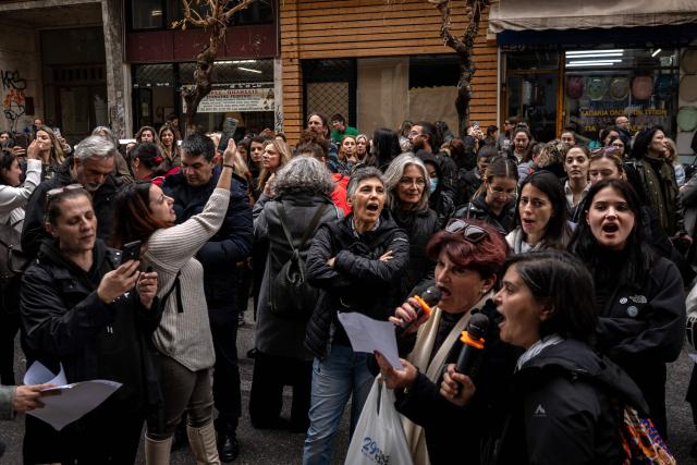 Midwives shout slogans during a protest against new restrictions in front of the Ministry of health in Athens, on February 5, 2026. Hundreds of midwives protested in Athens over new restrictions on how they work in hospitals that mean they will not be able to deliver babies without a doctor's supervision. (Photo by Angelos TZORTZINIS / AFP)