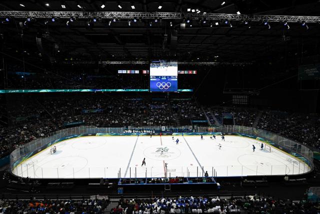 A general view shows players competing during the women's preliminary round group B Ice Hockey match between Italy and France at the Milano Santagiulia Ice Hockey Arena during the Milano Cortina 2026 Winter Olympic Games in Milan, on February 5, 2026. (Photo by JULIEN DE ROSA / AFP)