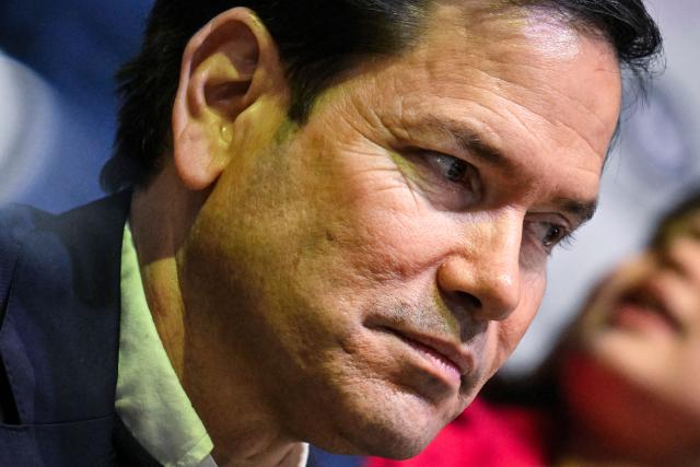 US Secretary of State Marco Rubio attends the women's preliminary round Group A Ice Hockey match between USA and Czech Republic at the Milano Rho Ice Hockey Arena during the Milano Cortina 2026 Winter Olympic Games in Milan, on February 5, 2026. (Photo by Alexander NEMENOV / AFP)