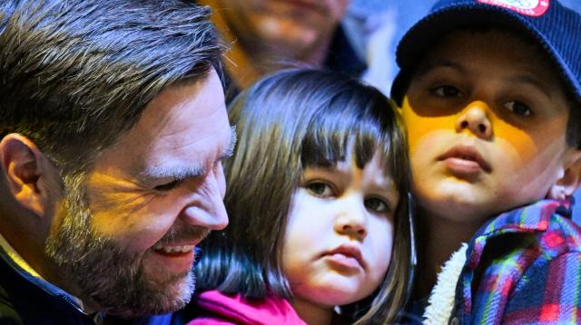 US Vice President JD Vance (L) smiles next to his daughter Mirabel (C) and his son Ewan during the women's preliminary round Group A Ice Hockey match between USA and Czech Republic at the Milano Rho Ice Hockey Arena during the Milano Cortina 2026 Winter Olympic Games in Milan, on February 5, 2026. (Photo by Alexander NEMENOV / AFP)