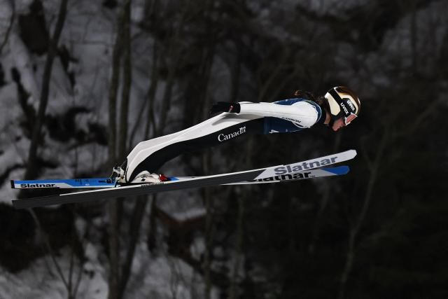 Canada's Abigail Strate jumps during the women's ski jumping normal hill training of the Milano Cortina 2026 Winter Olympic Games at Predazzo Ski Jumping Stadium in Predazzo (Val di Fiemme), on February 5, 2026. (Photo by Anne-Christine POUJOULAT / AFP)