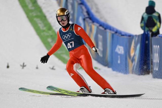 Norway's Anna Odine Stroem arrives in the finish area after she jumped during the women's ski jumping normal hill training of the Milano Cortina 2026 Winter Olympic Games at Predazzo Ski Jumping Stadium in Predazzo (Val di Fiemme), on February 5, 2026. (Photo by Javier SORIANO / AFP)