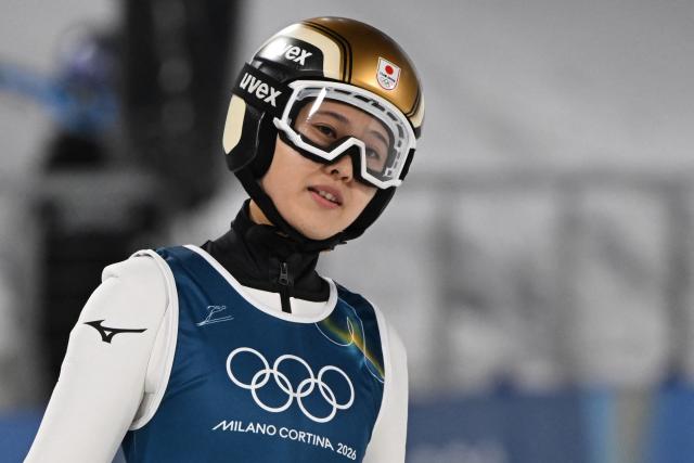 Japan's Nozomi Maruyama arrives in the finish area after she jumped during the women's ski jumping normal hill training of the Milano Cortina 2026 Winter Olympic Games at Predazzo Ski Jumping Stadium in Predazzo (Val di Fiemme), on February 5, 2026. (Photo by Javier SORIANO / AFP)