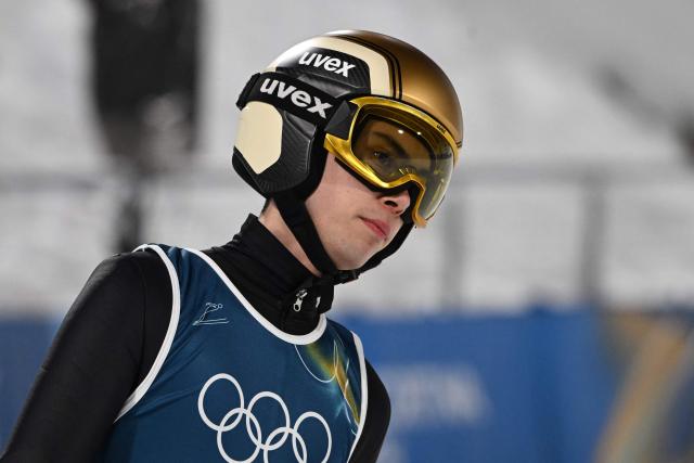 France's Valentin Foubert reacts as he arrives in the finish area after jumping during the men's ski jumping normal hill training of the Milano Cortina 2026 Winter Olympic Games at Predazzo Ski Jumping Stadium in Predazzo (Val di Fiemme), on February 5, 2026. (Photo by Javier SORIANO / AFP)