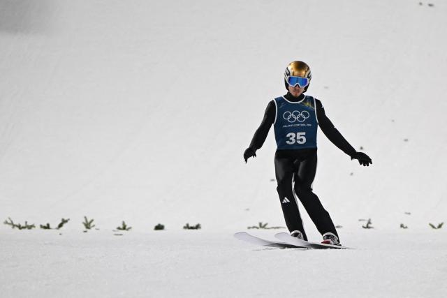 Norway's Johann Andre Forfang arrives in the finish area after jumping during the men's ski jumping normal hill training of the Milano Cortina 2026 Winter Olympic Games at Predazzo Ski Jumping Stadium in Predazzo (Val di Fiemme), on February 5, 2026. (Photo by Javier SORIANO / AFP)