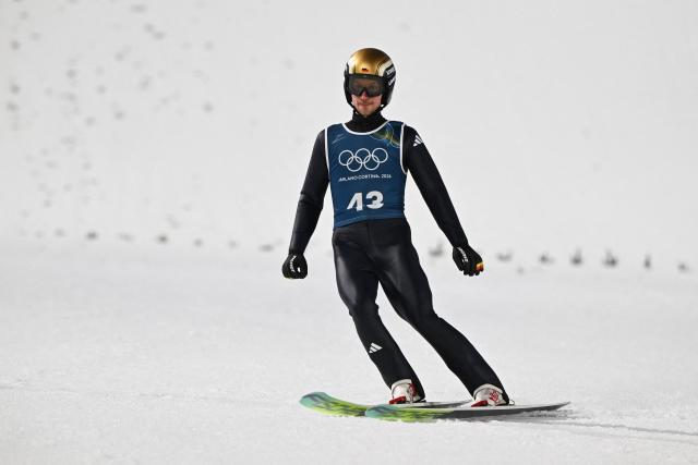 Germany's Felix Hoffmann arrives in the finish area after jumping during the men's ski jumping normal hill training of the Milano Cortina 2026 Winter Olympic Games at Predazzo Ski Jumping Stadium in Predazzo (Val di Fiemme), on February 5, 2026. (Photo by Javier SORIANO / AFP)