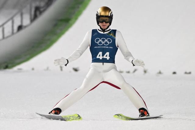 Austria's Jan Hoerl arrives in the finish area after a jump during the men's ski jumping normal hill training of the Milano Cortina 2026 Winter Olympic Games at Predazzo Ski Jumping Stadium in Predazzo (Val di Fiemme), on February 5, 2026. (Photo by Javier SORIANO / AFP)