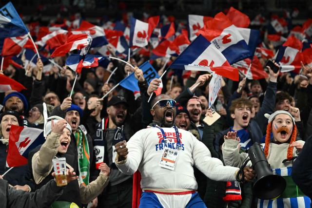 French supporters cheer their team ahead of the Six Nations international rugby union match between France and Ireland at the Stade de France in Saint-Denis, Paris' suburb, on February 5, 2026. (Photo by Julie SEBADELHA / AFP)