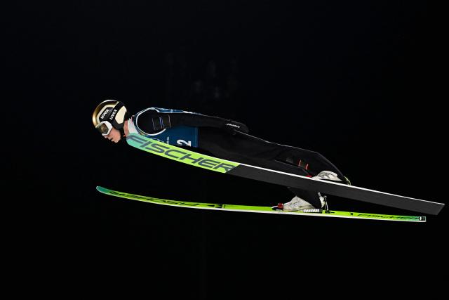 Austria's Stephan Embacher jumps during the men's ski jumping normal hill training of the Milano Cortina 2026 Winter Olympic Games at Predazzo Ski Jumping Stadium in Predazzo (Val di Fiemme), on February 5, 2026. (Photo by Tobias SCHWARZ / AFP)