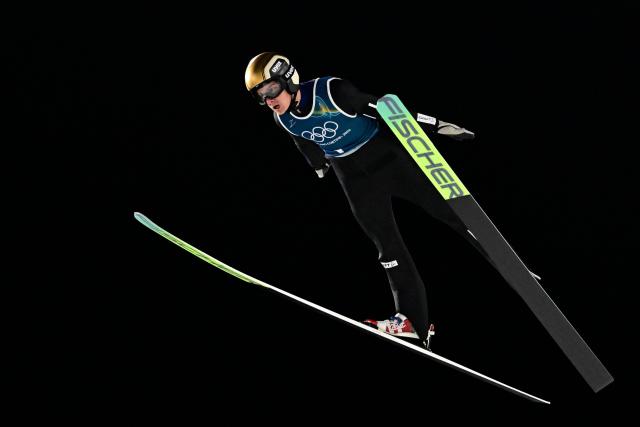 France's Enzo Milesi jumps during the men's ski jumping normal hill training of the Milano Cortina 2026 Winter Olympic Games at Predazzo Ski Jumping Stadium in Predazzo (Val di Fiemme), on February 5, 2026. (Photo by Tobias SCHWARZ / AFP)