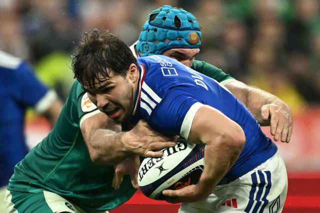 France's scrum-half Antoine Dupont is tackled by Ireland's lock Tadhg Beirne during the Six Nations international rugby union match between France and Ireland at the Stade de France in Saint-Denis, Paris' suburb, on February 5, 2026. (Photo by Julie SEBADELHA / AFP)