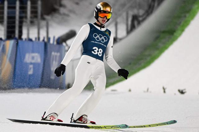 Poland's Kacper Tomasiak  arrives in the finish area after jumping during the men's ski jumping normal hill training of the Milano Cortina 2026 Winter Olympic Games at Predazzo Ski Jumping Stadium in Predazzo (Val di Fiemme), on February 5, 2026. (Photo by Javier SORIANO / AFP)