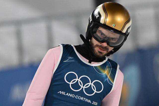 Bulgaria's Vladimir Zografski reacts after a jump during the men's ski jumping normal hill training of the Milano Cortina 2026 Winter Olympic Games at Predazzo Ski Jumping Stadium in Predazzo (Val di Fiemme), on February 5, 2026. (Photo by Javier SORIANO / AFP)
