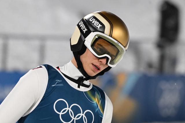 Austria's Stephan Embacher reacts after a jump during the men's ski jumping normal hill training of the Milano Cortina 2026 Winter Olympic Games at Predazzo Ski Jumping Stadium in Predazzo (Val di Fiemme), on February 5, 2026. (Photo by Javier SORIANO / AFP)