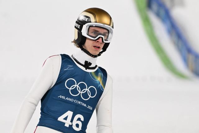 Austria's Daniel Tschofenig arrives in the finish area after jumping during the men's ski jumping normal hill training of the Milano Cortina 2026 Winter Olympic Games at Predazzo Ski Jumping Stadium in Predazzo (Val di Fiemme), on February 5, 2026. (Photo by Javier SORIANO / AFP)