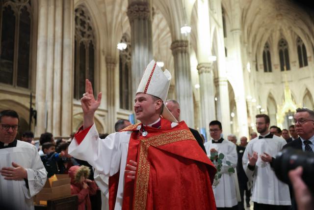 Archibishop-designate Ronald Hicks exits after Solemn Vespers evening prayer service, ahead of his installation as New York Archbishop at St. Patrick's Cathedral in New York on February 5, 2026. In a significant shift for the US Catholic Church, Pope Leo XIV replaced Timothy Dolan, who stepped down after reaching the church's retirement age of 75, with Hicks, a 58-year-old bishop from Illinois. (Photo by ANGELA WEISS / AFP)
