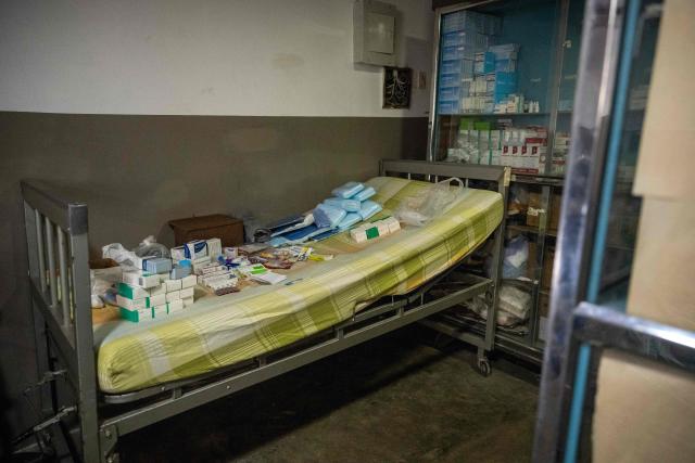 A gurney stretcher with medications on it is seen at a volunteer medical clinic in the neighborhood of San Luis in Maracaibo, Zulia state, Venezuela, on January 30, 2026. The Lake Maracaibo region in Venezuela holds the world’s highest concentration of Huntington’s disease (HD), with a prevalence of roughly 700 per 100,000 in certain areas. (Photo by Maryorin Mendez / AFP)