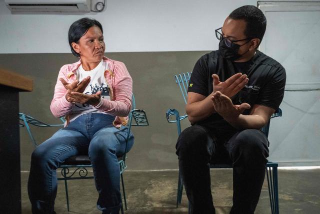 A physician checks a Huntington’s patient at a volunteer medical clinic in the neighborhood of San Luis in Maracaibo, Zulia state, Venezuela, on January 30, 2026. The Lake Maracaibo region in Venezuela holds the world’s highest concentration of Huntington’s disease (HD), with a prevalence of roughly 700 per 100,000 in certain areas. (Photo by Maryorin Mendez / AFP)