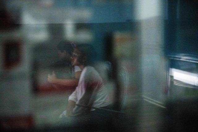 A Huntington’s patient waits for her medical examination at a volunteer medical clinic in the neighborhood of San Luis in Maracaibo, Zulia state, Venezuela, on January 30, 2026. The Lake Maracaibo region in Venezuela holds the world’s highest concentration of Huntington’s disease (HD), with a prevalence of roughly 700 per 100,000 in certain areas. (Photo by Maryorin Mendez / AFP)