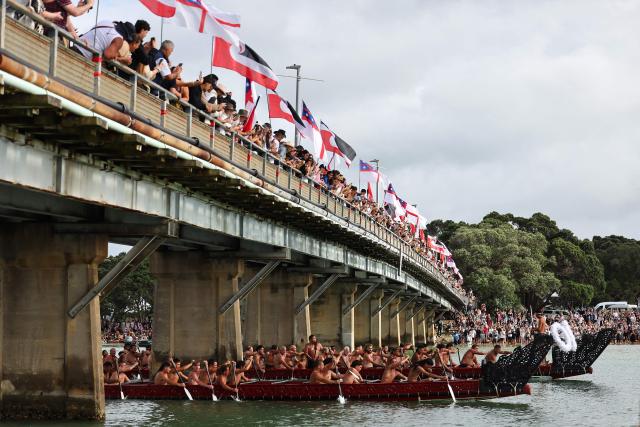 Participants paddle their boats during a waka ceremony in Waitangi on February 6, 2026, as part of Waitangi Day commemorations, an annual national event where Indigenous Maori groups highlight ongoing political concerns. (Photo by Ben STRANG / AFP)