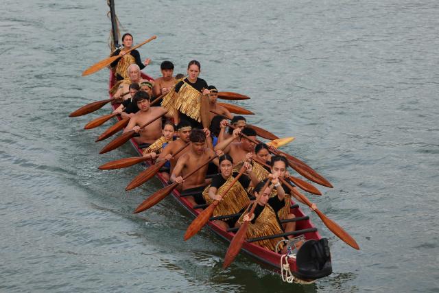 Participants paddle their boat during a waka ceremony in Waitangi on February 6, 2026, as part of Waitangi Day commemorations, an annual national event where Indigenous Maori groups highlight ongoing political concerns. (Photo by Ben STRANG / AFP)