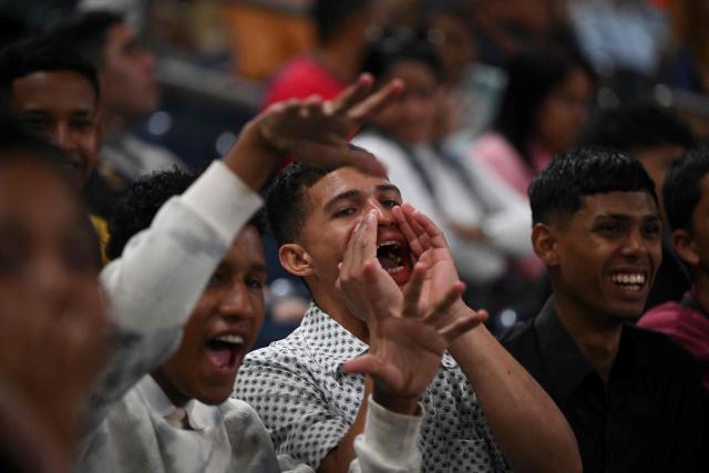 A Venezuelan fan cheers for his team during a game of the 2026 Series of the Americas between Venezuela's Navegantes del Magallanes and Panama's Aguilas Metropolitanas at the Simon Bolivar Monumental Stadium in Caracas on February 5, 2026. (Photo by Federico PARRA / AFP)