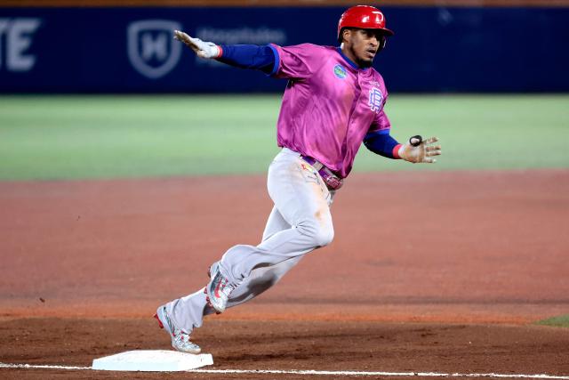 Leones del Escogido's #38 Jimmy Paredes runs to home in the fourth inning of the Caribbean Series baseball tournament tenth game between Dominican Republic's Leones del Escogido and Mexico's Tomateros de Culiacan at the Panamerican Stadium in Jalisco, Mexico, on February 5, 2026. (Photo by Ulises Ruiz / AFP)