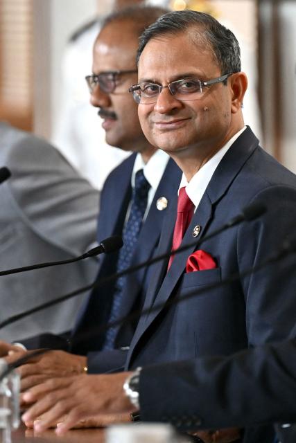The Reserve Bank of India (RBI) Governor Sanjay Malhotra (R) addresses a press conference in Mumbai on February 6, 2026. The RBI Monetary Policy Committee (MPC) has announced unanimously that the central bank's  repo rate remains unchanged at 5.25 per cent. (Photo by Indranil MUKHERJEE / AFP)