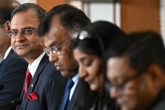 The Reserve Bank of India (RBI) Governor Sanjay Malhotra (L) addresses a press conference in Mumbai on February 6, 2026. The RBI Monetary Policy Committee (MPC) has announced unanimously that the central bank's  repo rate remains unchanged at 5.25 per cent. (Photo by Indranil Mukherjee / AFP)