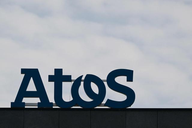(FILES) A photo shows the logo of French IT consultancy company Atos on a building in Rennes, western France, on March 21, 2024. Nearly 700 shareholders of the Atos group are suing audit firms Deloitte and Grant Thornton, accusing them of concealing the company's financial situation for several years, according to the summons seen by AFP on February 6, 2026. (Photo by Damien MEYER / AFP)