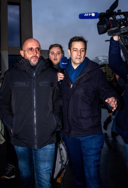 The co-owner of Le Constellation bar Jacques Moretti (L) arrives with his lawyer, Patrick Michod (R) for a hearing before the public prosecutor of the canton of Valais, on February 6, 2026 in Sion, after 41 people, most of them teenagers, were killed, while 116 were injured, in a fire that ripped through in Le Constellation bar in the Alpine ski resort of Crans-Montana on New Year's Eve. (Photo by Maxime SCHMID / AFP)