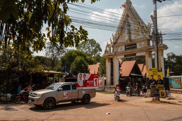 A pickup truck with a Pheu Thai poster leaves after a campaign event held at Wat Nong Waeng in the Thai border province of Sa Kaeo, which borders with Cambodia, on February 4, 2026. Thailand's rural northeast has long been a stronghold of populist leader Thaksin Shinawatra, but renewed conflict along the Cambodian border has changed that ahead of elections on February 8. (Photo by ANTHONY WALLACE / AFP) / TO GO WITH thailand-vote-conflict-economy, FOCUS by Montira Rungjirajittranon