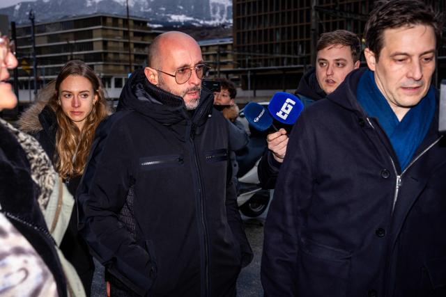 The co-owner of Le Constellation bar Jacques Moretti (C) arrives with his lawyer, Patrick Michod (R) for a hearing before the public prosecutor of the canton of Valais, on February 6, 2026 in Sion, after 41 people, most of them teenagers, were killed, while 116 were injured, in a fire that ripped through in Le Constellation bar in the Alpine ski resort of Crans-Montana on New Year's Eve. (Photo by Maxime SCHMID / AFP)
