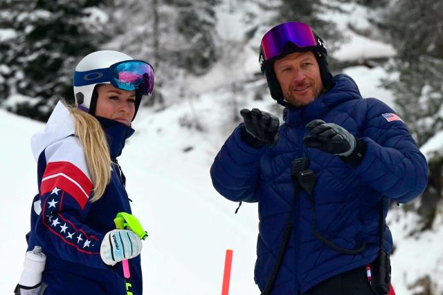 US' Lindsey Vonn inspects the slope with her coach Norway's former skier Aksel Lund Svindal before the second official training for the women's downhill event at the Tofane Alpine Skiing Centre during Milano Cortina 2026 Winter Olympic Games in Cortina d’Ampezzo on February 6, 2026. (Photo by Stefano RELLANDINI / AFP)