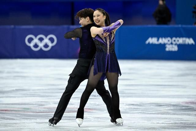 Japan's Utana Yoshida (R) and Japan's Masaya Morita compete in the figure skating team event ice dance-rhythm dance during the Milano Cortina 2026 Winter Olympic Games at Milano Ice Skating Arena in Milan on February 6, 2026. (Photo by WANG Zhao / AFP)