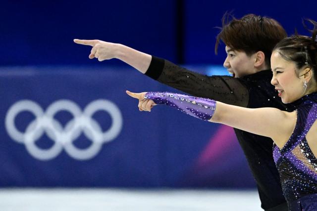 Japan's Utana Yoshida (R) and Japan's Masaya Morita compete in the figure skating team event ice dance-rhythm dance during the Milano Cortina 2026 Winter Olympic Games at Milano Ice Skating Arena in Milan on February 6, 2026. (Photo by WANG Zhao / AFP)