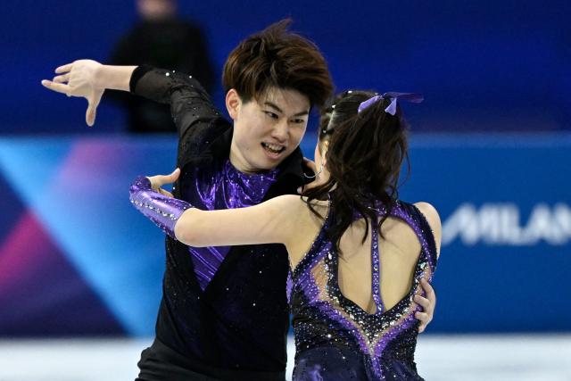 Japan's Utana Yoshida (R) and Japan's Masaya Morita compete in the figure skating team event ice dance-rhythm dance during the Milano Cortina 2026 Winter Olympic Games at Milano Ice Skating Arena in Milan on February 6, 2026. (Photo by WANG Zhao / AFP)