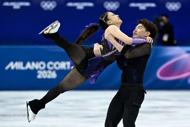 Japan's Utana Yoshida (L) and Japan's Masaya Morita compete in the figure skating team event ice dance-rhythm dance during the Milano Cortina 2026 Winter Olympic Games at Milano Ice Skating Arena in Milan on February 6, 2026. (Photo by WANG Zhao / AFP)