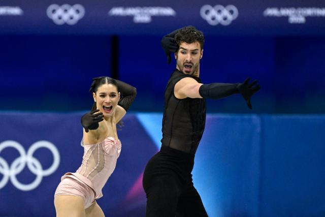 France's Laurence Fournier Beaudry (L) and France's Guillaume Cizeron compete in the figure skating team event ice dance-rhythm dance during the Milano Cortina 2026 Winter Olympic Games at Milano Ice Skating Arena in Milan on February 6, 2026. (Photo by WANG Zhao / AFP)