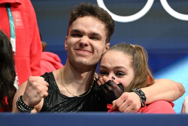 Poland's Sofiia Dovhal (R) and Poland's Wiktor Kulesza react after competing in the figure skating team event ice dance-rhythm dance during the Milano Cortina 2026 Winter Olympic Games at Milano Ice Skating Arena in Milan on February 6, 2026. (Photo by WANG Zhao / AFP)